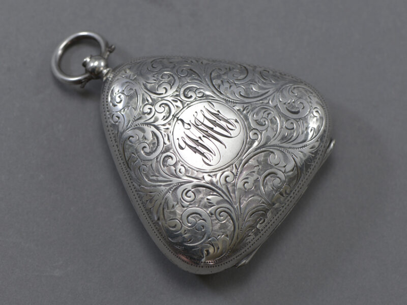 William Neale Edwardian Triple Sovereign Holder triangular form with bale handle, engraved body and monogrammed cartouche