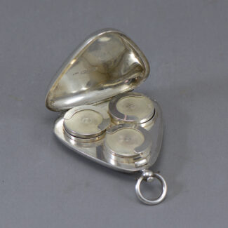 triangular triple sovereign holder case with bale handle and lever action enclosure