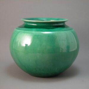 Spherical vase with green glaze made by Herman kahler.
