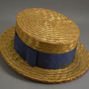 straw boating hat from the 1920s with a navy blue ribbon