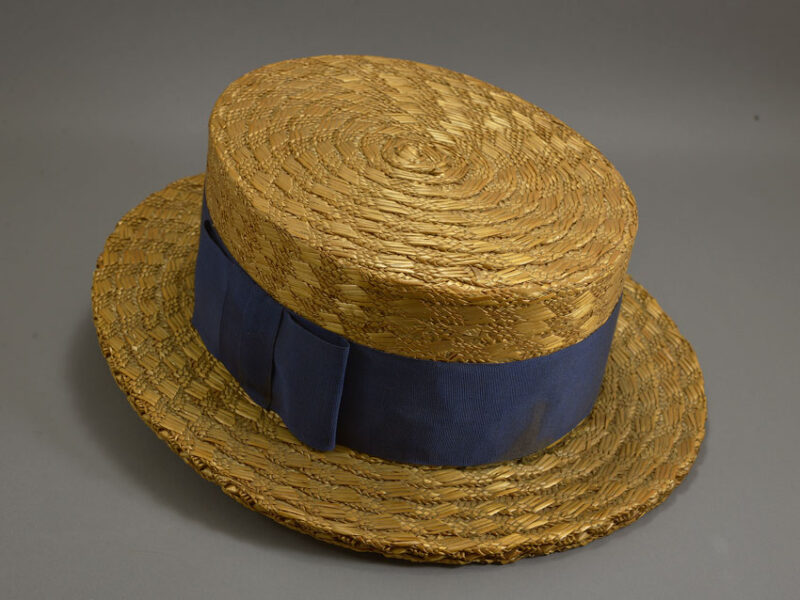The Shuttleworth Canadian Boating Hat straw boating hat from the 1920s with a navy blue ribbon