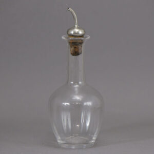 Clear glass bottle with long neck, stopped with a cork set sterling silver sprinkler top