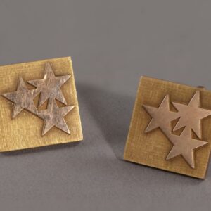 Square cufflinks with three applied five pointed stars