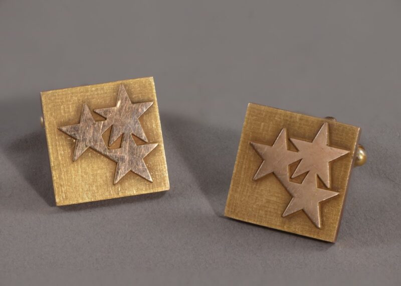 Square cufflinks with three applied five pointed stars