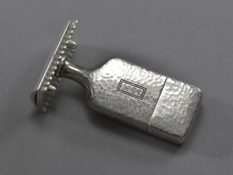 The modular travel razor is put together for use.