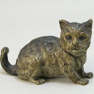 Cold-painted bronze figurine modelled as a cheshire cat